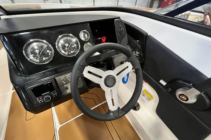 Slide: The Image of 2025 Bayliner V20i dashboard with steering wheel and instrument panel. - 10