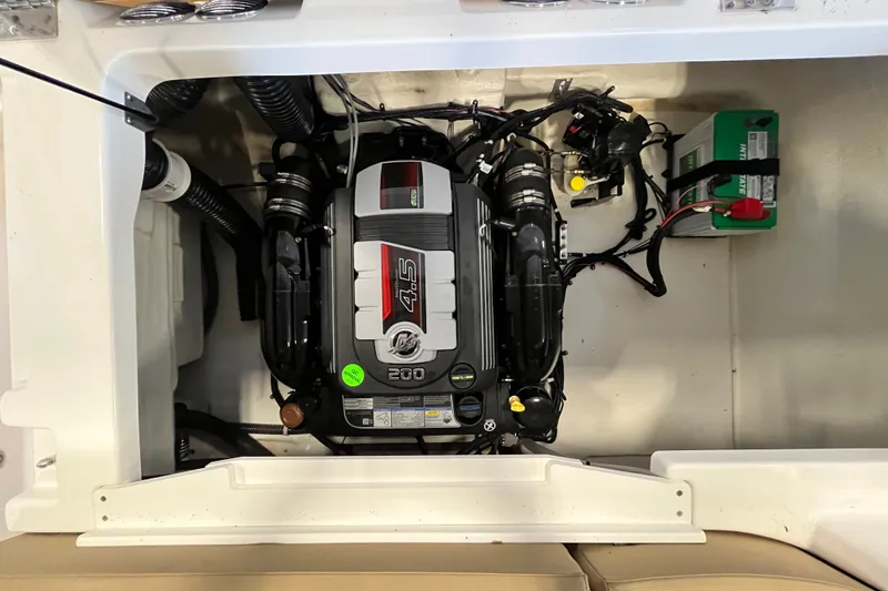 Slide: The Image of Engine compartment of 2025 Bayliner V20i boat, featuring a 4.5L 200 HP engine. - 16