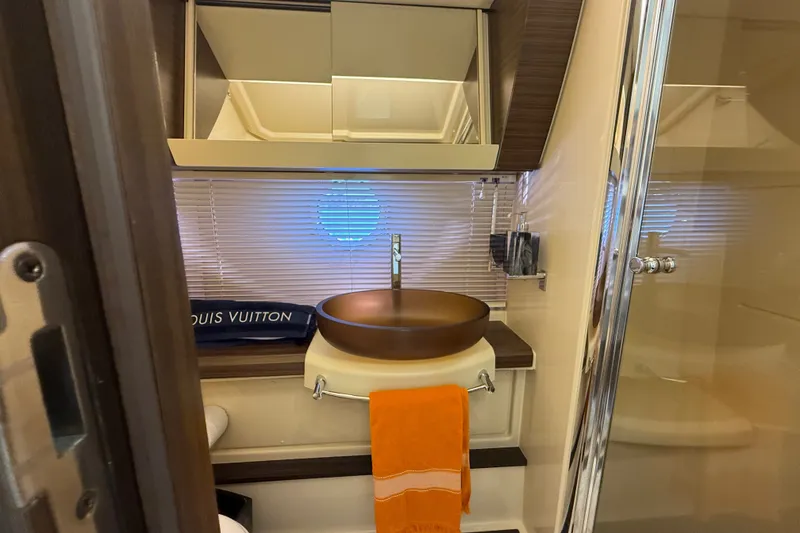 Slide: The Image of Luxurious bathroom interior of 2015 Azimut 54 yacht with modern sink and orange towel. - 92