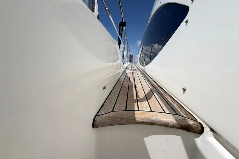 Slide: The Image of Side deck view of 2015 Azimut 54 yacht under clear blue sky. - 54