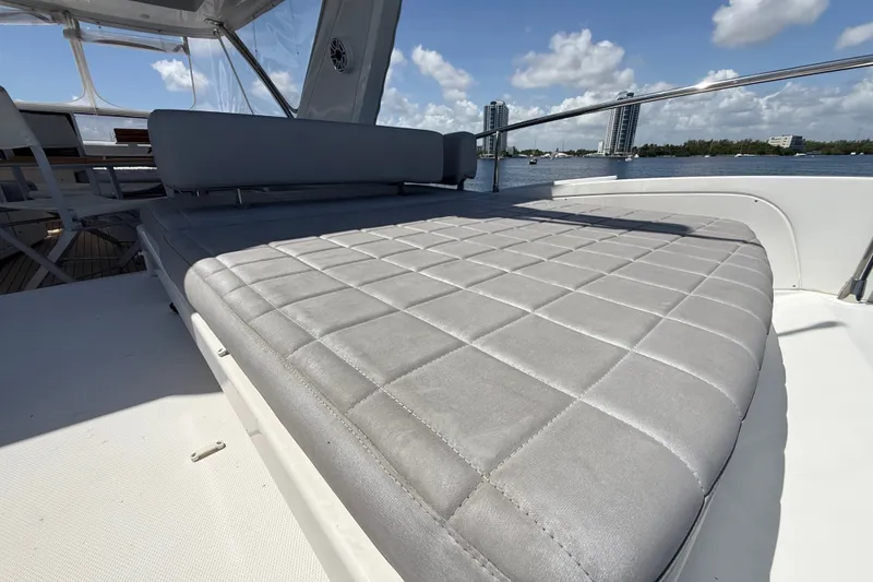 Slide: The Image of Luxurious sunbed on 2015 Azimut 54 yacht, with scenic waterfront view. - 25