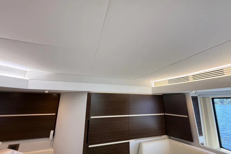 Slide: The Image of Interior of 2015 Azimut 54 yacht with modern wood paneling and sleek design. - 90