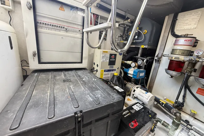 Slide: The Image of Engine room of a 2015 Azimut 54 yacht, featuring electrical panels and equipment. - 108