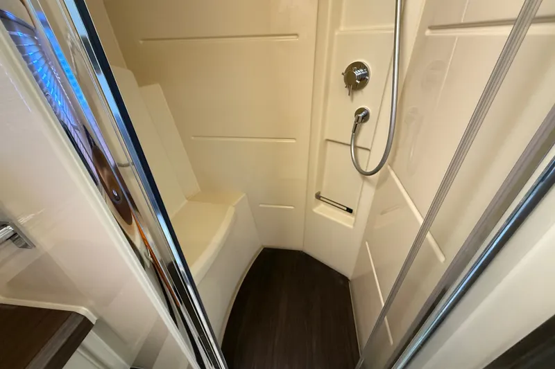 Slide: The Image of Shower area in 2015 Azimut 54 yacht with modern fixtures and seating. - 94
