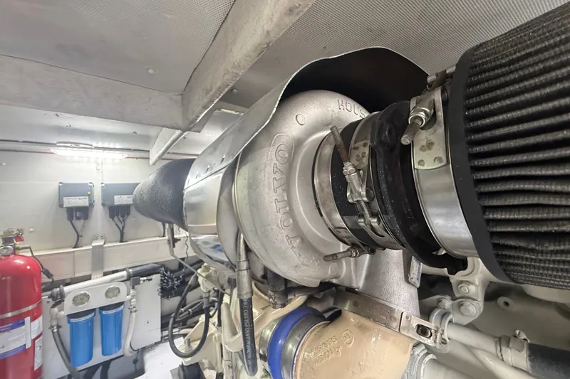Slide: The Image of Engine room of 2015 Azimut 54 yacht, featuring a Volvo turbocharger. - 110