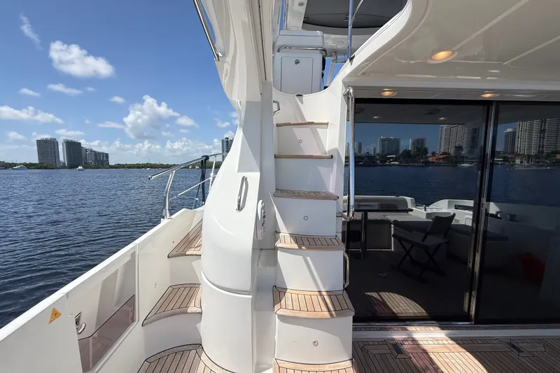 Slide: The Image of Luxurious 2015 Azimut 54 yacht with elegant deck and scenic waterfront view. - 52