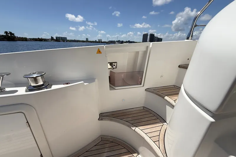 Slide: The Image of 2015 Azimut 54 yacht deck with wooden steps and ocean view. - 55