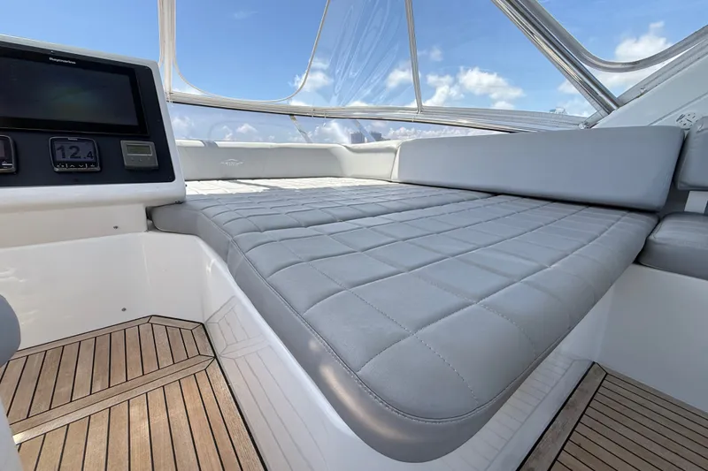 Slide: The Image of Luxurious interior of 2015 Azimut 54 yacht with plush seating and navigation display. - 36