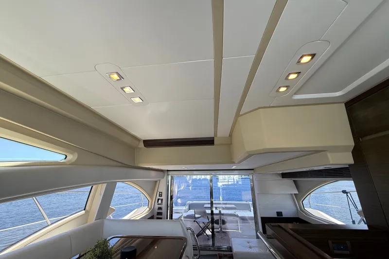 Slide: The Image of Interior of a 2015 Azimut 54 yacht, featuring modern design and large windows. - 76