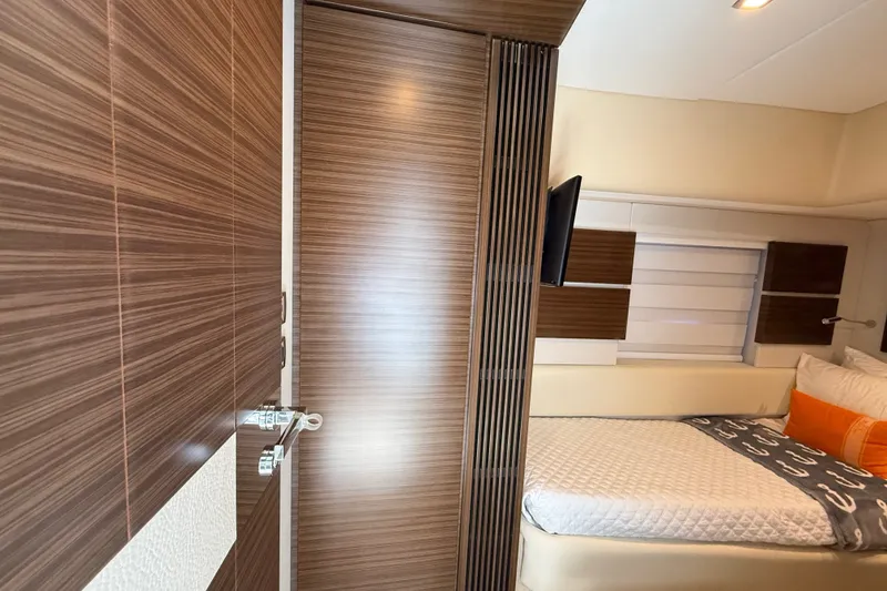 Slide: The Image of Luxurious interior of 2015 Azimut 54 yacht with modern wood paneling and cozy bedroom. - 84