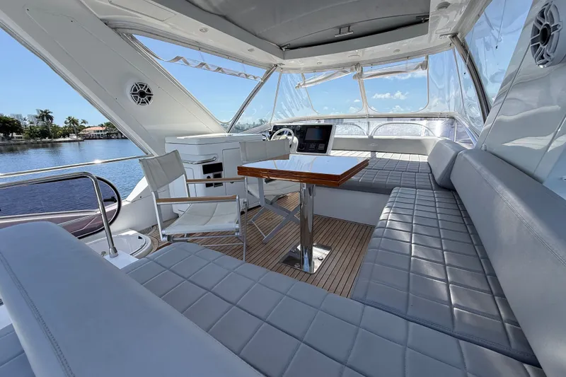 Slide: The Image of Luxurious 2015 Azimut 54 yacht interior with elegant seating and scenic water views. - 28
