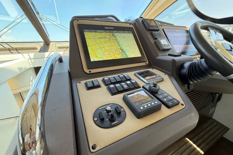 Slide: The Image of Cockpit of 2015 Azimut 54 yacht with navigation controls and display screen. - 74