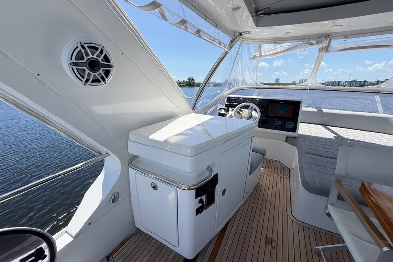 Slide: The Image of Interior view of 2015 Azimut 54 yacht helm with modern controls and seating. - 41