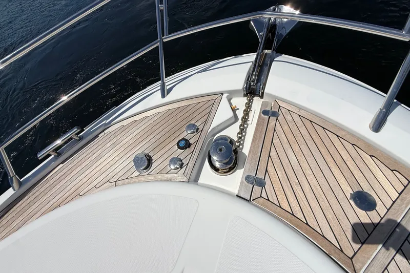 Slide: The Image of Bow deck of 2015 Azimut 54 yacht with teak flooring and anchor chain. - 18