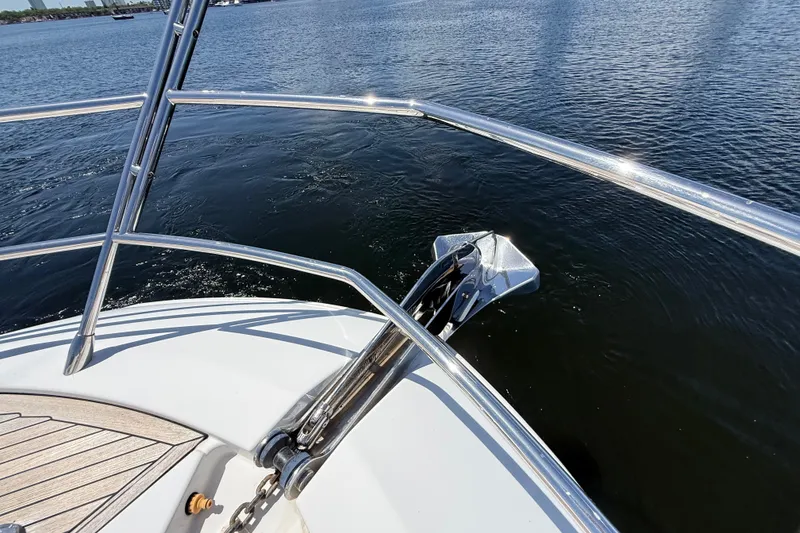 Slide: The Image of Bow view of 2015 Azimut 54 yacht with anchor over calm water. - 17