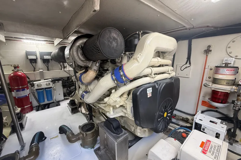 Slide: The Image of Engine room of a 2015 Azimut 54 yacht, showcasing machinery and equipment. - 105