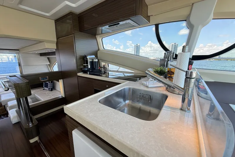 Slide: The Image of Luxurious interior of a 2015 Azimut 54 yacht with modern kitchen and scenic window view. - 77