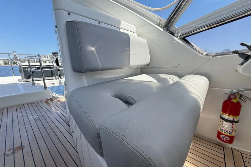Slide: The Image of Luxury seating on 2015 Azimut 54 yacht with teak flooring and fire extinguisher. - 38