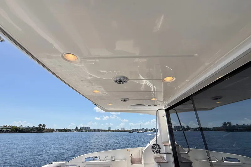 Slide: The Image of Luxurious 2015 Azimut 54 yacht deck with scenic waterfront view. - 57