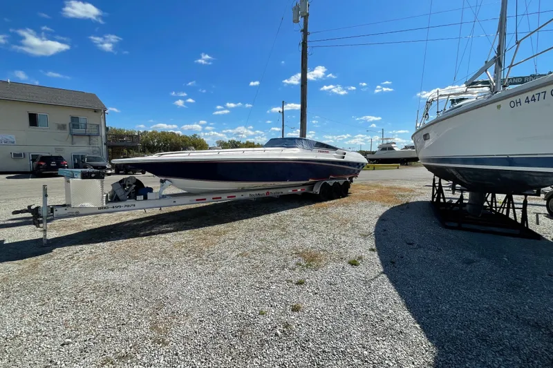 Slide: The Image of 2002 Fountain 35 Lightning boat on trailer in sunny outdoor setting. - 3
