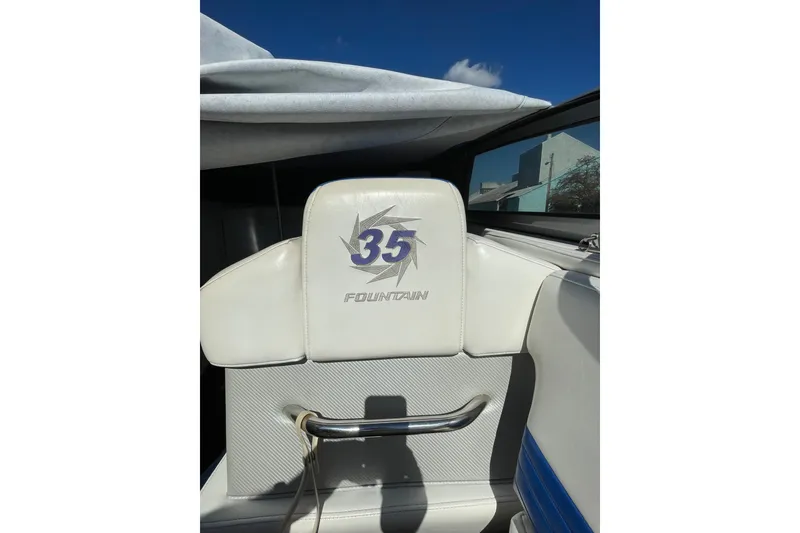 Slide: The Image of White seat with "35 Fountain" logo on a 2002 Fountain 35 Lightning boat. - 23