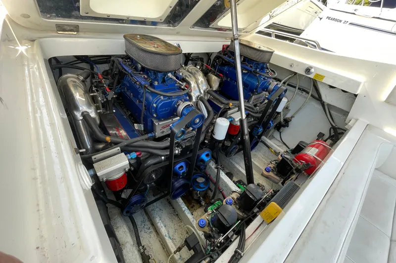 Slide: The Image of Engine compartment of a 2002 Fountain 35 Lightning boat, showcasing dual engines. - 9