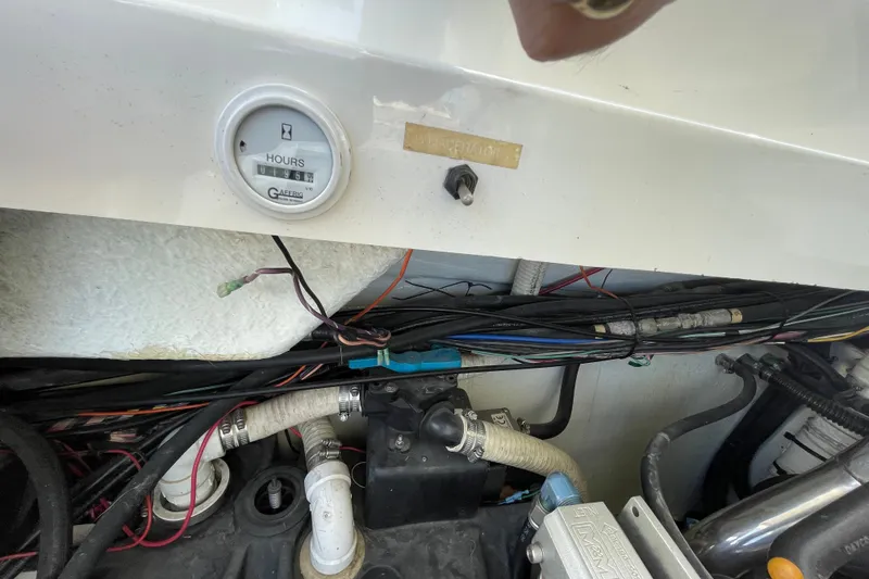 Slide: The Image of Engine compartment of a 2002 Fountain 35 Lightning boat with hour meter and wiring. - 7