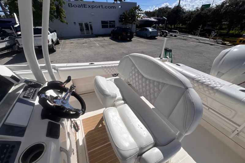 Slide: The Image of 2017 Robalo R242 Center Console boat interior with steering wheel and seating. - 14