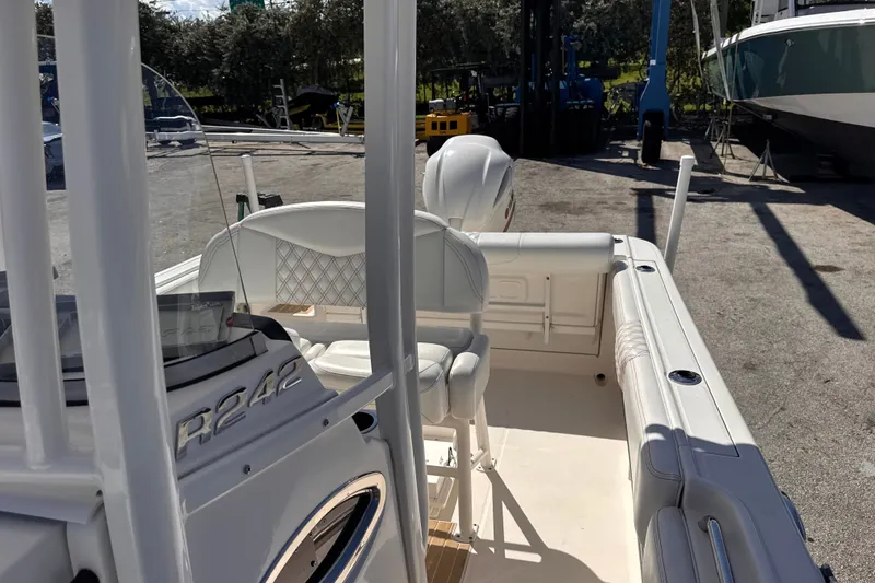 Slide: The Image of 2017 Robalo R242 Center Console boat interior at a marina. - 20
