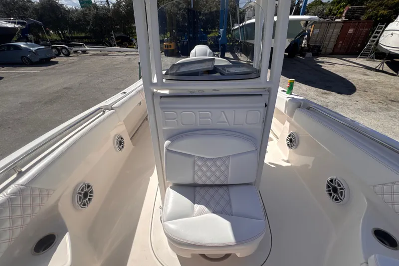 Slide: The Image of 2017 Robalo R242 Center Console boat interior with seating and speakers. - 16