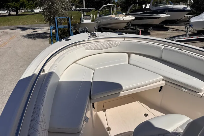 Slide: The Image of 2017 Robalo R242 Center Console boat with spacious seating and sleek design. - 15