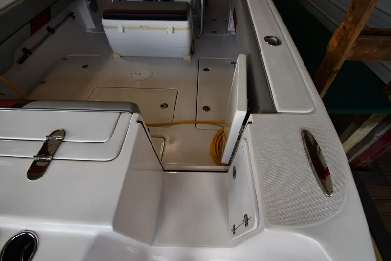 Slide: The Image of 2009 Donzi 38 ZFX Open boat interior with storage compartments and seating. - 25