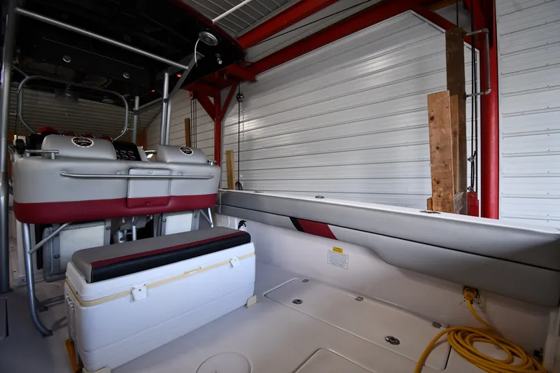 Slide: The Image of Interior of a 2009 Donzi 38 ZFX Open boat in a garage setting. - 22