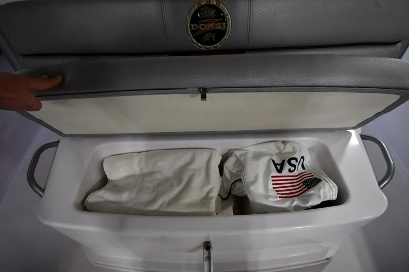 Slide: The Image of Open storage compartment in 2009 Donzi 38 ZFX Open boat with towel and USA flag item. - 41