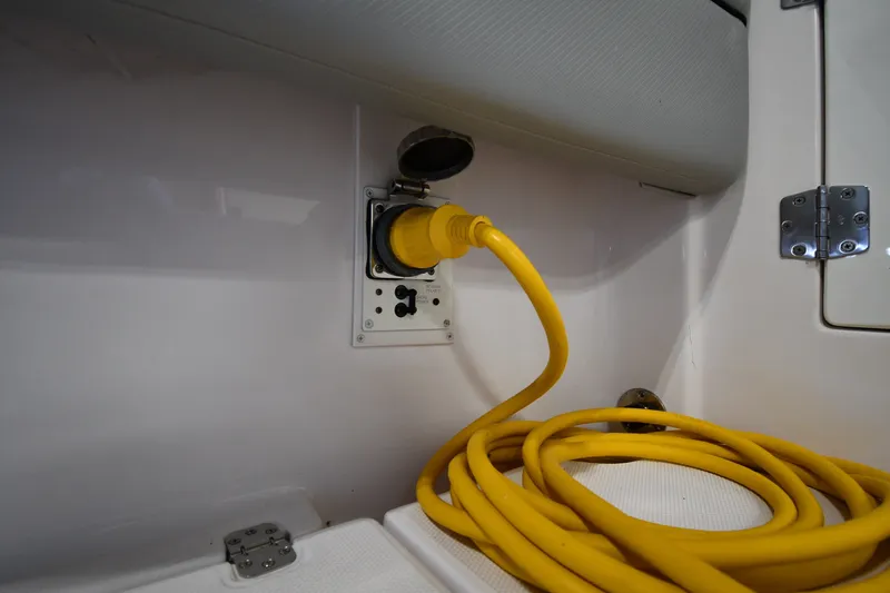 Slide: The Image of Yellow power cable connected inside 2009 Donzi 38 ZFX Open boat. - 50