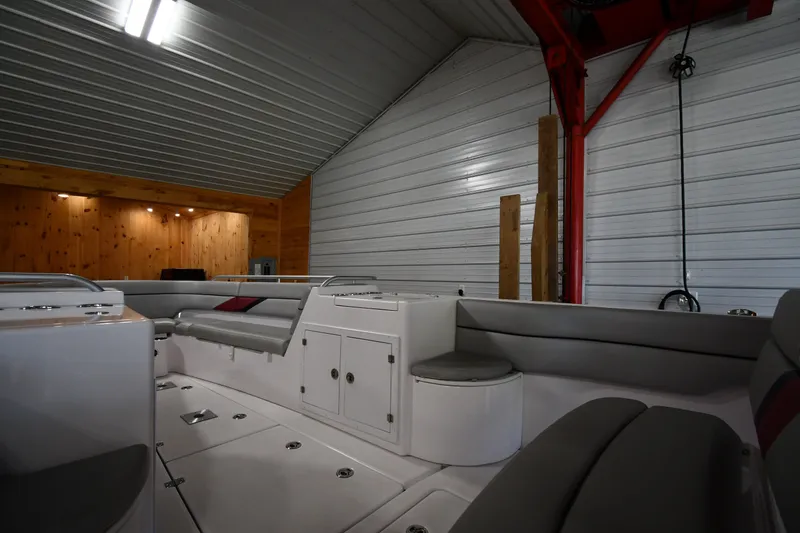 Slide: The Image of 2009 Donzi 38 ZFX Open boat interior in a spacious garage with wooden accents. - 30