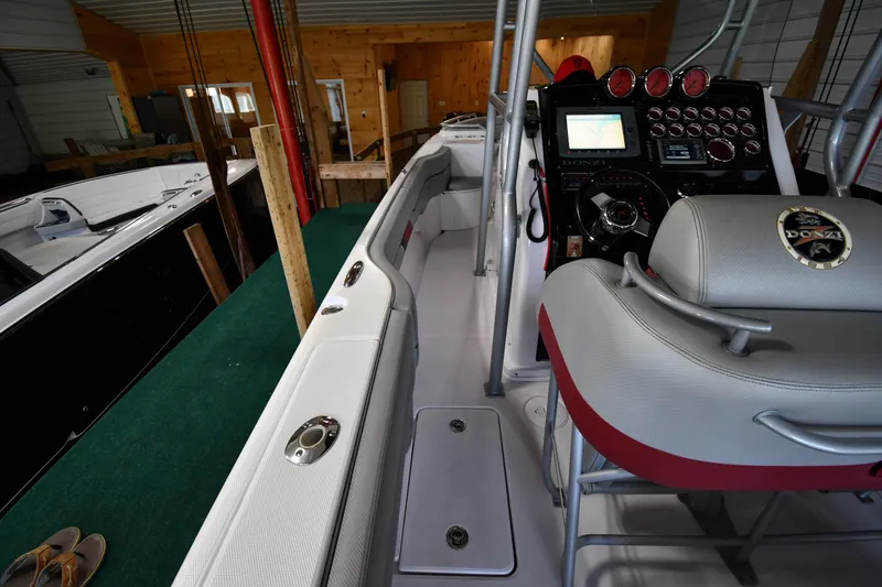 Slide: The Image of Interior view of a 2009 Donzi 38 ZFX Open boat with control panel and seating. - 28