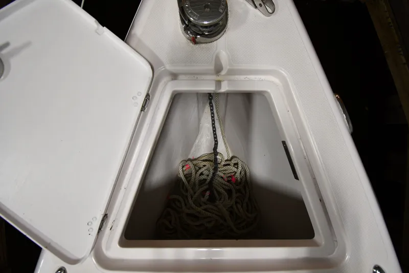 Slide: The Image of Open storage compartment on 2009 Donzi 38 ZFX Open boat with rope inside. - 13