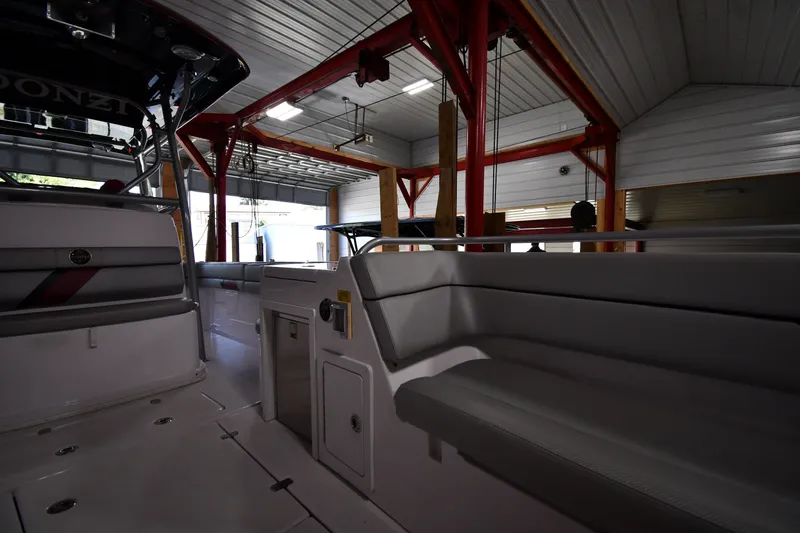 Slide: The Image of 2009 Donzi 38 ZFX Open boat interior in a garage with red beams. - 34
