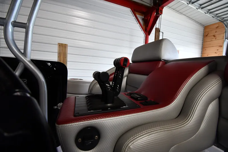 Slide: The Image of Interior of a 2009 Donzi 38 ZFX Open boat, featuring sleek red and gray seating. - 20