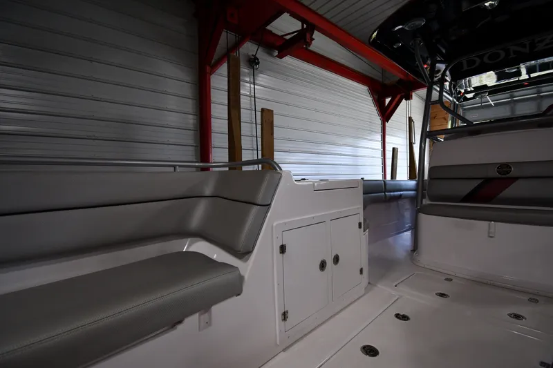 Slide: The Image of Interior of a 2009 Donzi 38 ZFX Open boat with seating and storage compartments. - 35