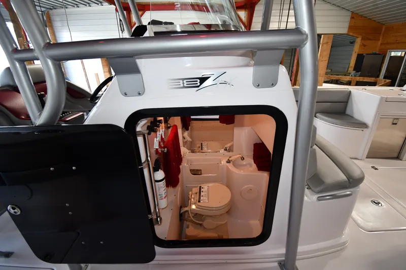 Slide: The Image of 2009 Donzi 38 ZFX Open boat interior with visible cabin and amenities. - 42