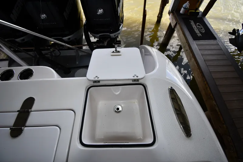 Slide: The Image of 2009 Donzi 38 ZFX Open boat with sink and Mercury engines in dock. - 27