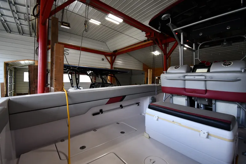Slide: The Image of 2009 Donzi 38 ZFX Open boat interior in a garage setting. - 23