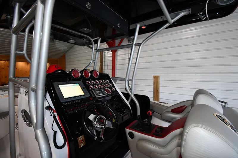 Slide: The Image of 2009 Donzi 38 ZFX Open boat cockpit with navigation system and steering wheel. - 18