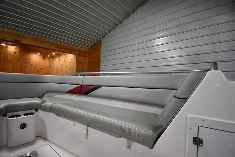 Slide: The Image of Interior of 2009 Donzi 38 ZFX Open boat with gray seating and wooden accents. - 32