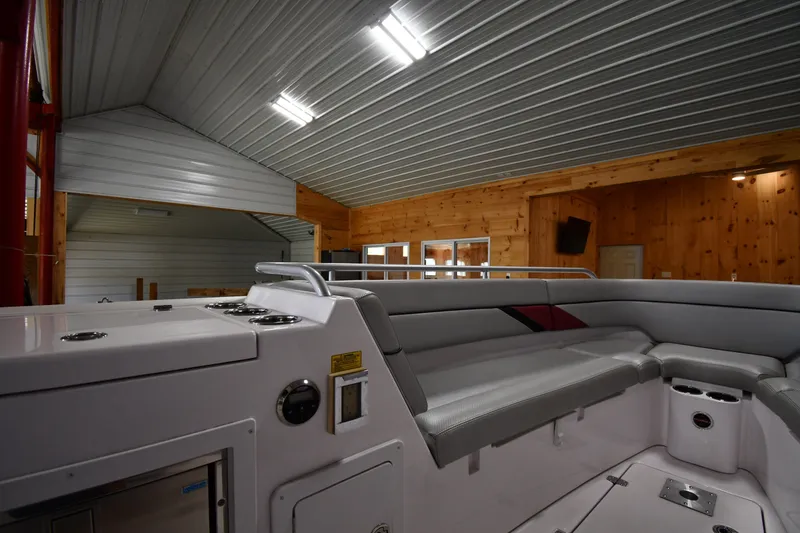 Slide: The Image of 2009 Donzi 38 ZFX Open boat interior in a wooden boathouse with metal ceiling. - 33