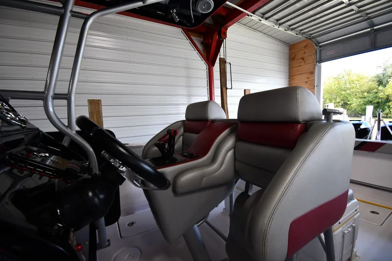 Slide: The Image of Interior of a 2009 Donzi 38 ZFX Open boat with steering wheel and seats. - 21