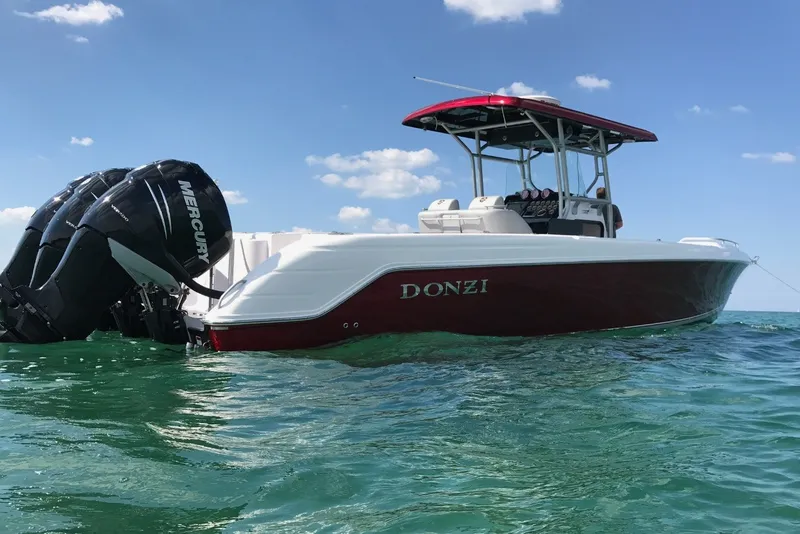 Slide: The Image of 2009 Donzi 38 ZFX Open boat with Mercury engines on clear water. - 1