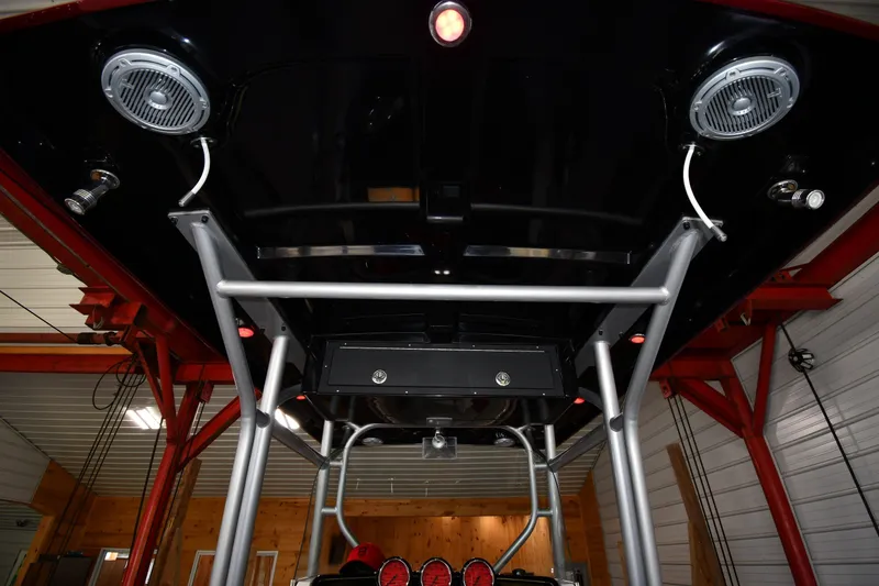 Slide: The Image of 2009 Donzi 38 ZFX Open boat interior with speakers and metal framework. - 54
